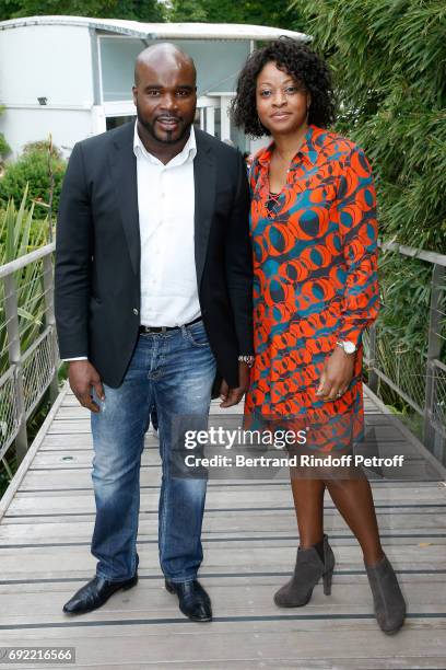 Boxer Jean-Marc Mormeck and his wife Sandra attend the 2017 French Tennis Open - Day Height at Roland Garros on June 4, 2017 in Paris, France.