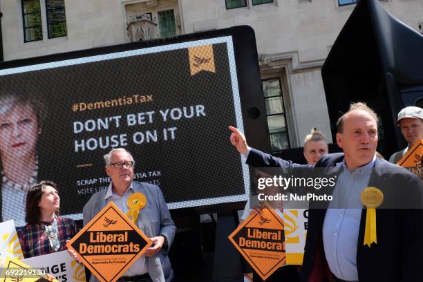 Simon Hughes reveals a new campaign poster of attacking Theresa May accompanied by the words: &quot;Don't bet your house on her.&quot; in London on...