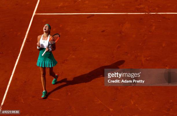 Kristina Mladenovic of France celebrates victory in the ladies singles fourth round match against Gabine Muguruza of Spain on day eight of the 2017...