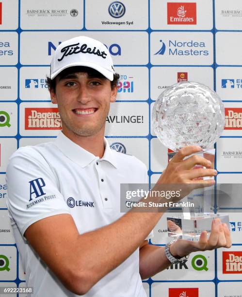 Renato Paratore of Italy poses with the trophy after his victory during day four of the Nordea Masters at Barseback Golf & Country Club on June 4,...