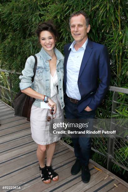 Actors Pauline Cheviller and Charles Berling attend the 2017 French Tennis Open - Day Height at Roland Garros on June 4, 2017 in Paris, France.