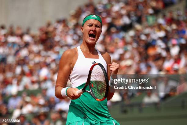 Kristina Mladenovic of France celebrates victory in the ladies singles fourth round match against Gabine Muguruza of Spain on day eight of the 2017...