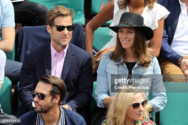 Actor Jamie Bamber and his wife singer Kerry Norton are spotted on central court at Roland Garros on June 4, 2017 in Paris, France.