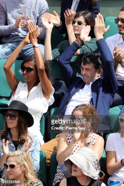 Tv presenters Stephane Plaza and Karine Le Marchand are spotted on central court at Roland Garros on June 4, 2017 in Paris, France.