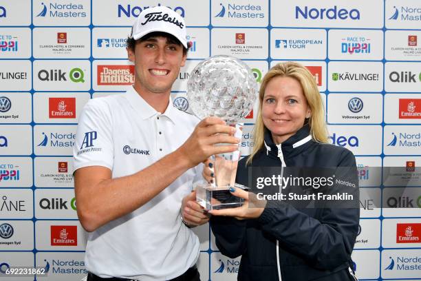 Renato Paratore of Italy poses with the trophy and Anna Storaker after his victory during day four of the Nordea Masters at Barseback Golf & Country...