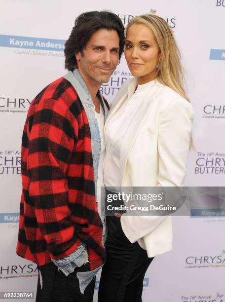 Elizabeth Berkley and Greg Lauren arrive at the 16th Annual Chrysalis Butterfly Ball at a private residence on June 3, 2017 in Brentwood, California.