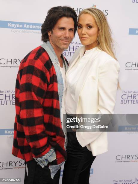 Elizabeth Berkley and Greg Lauren arrive at the 16th Annual Chrysalis Butterfly Ball at a private residence on June 3, 2017 in Brentwood, California.