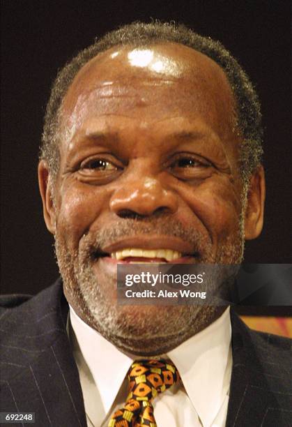 Actor Danny Glover smiles as he is interviewed during an event celebrating Martin Luther Kings birthday January 17, 2002 at Smithsonians National...