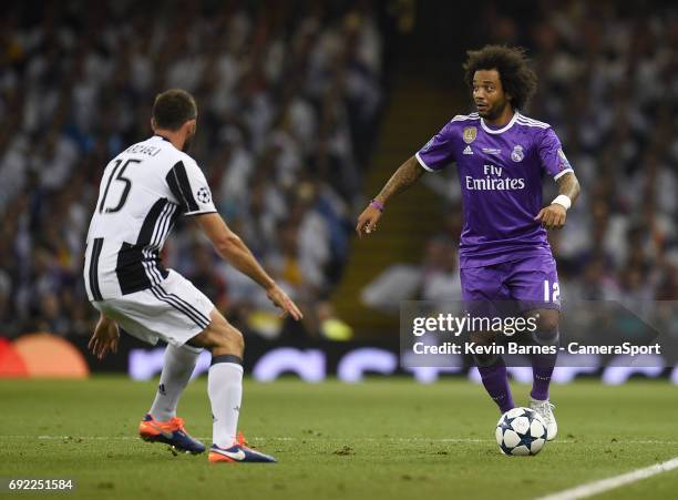 Marcelo of Real Madrid under pressure from Andrea Barzagli of Juventus during the UEFA Champions League Final match between Juventus and Real Madrid...