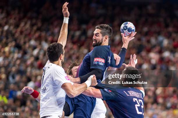 Nikola Karabatic of Paris is attacked by the defense of Vardar during the VELUX EHF FINAL4 Final match between Paris Saint-Germain Handball and HC...