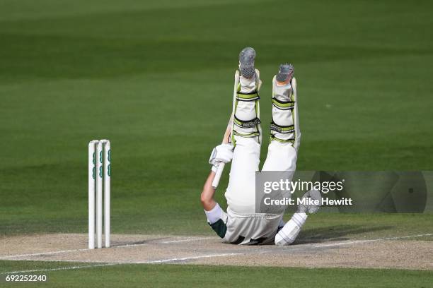 Daryl Mitchell of Worcestershire takes a tumble avoiding a Chris Jordan bouncer during the third day of the Specsavers County Championship Division...