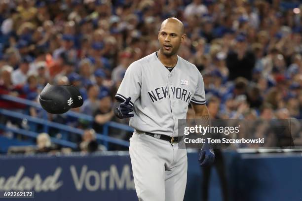 Aaron Hicks of the New York Yankees reacts after striking out to end the second inning during MLB game action against the Toronto Blue Jays at Rogers...