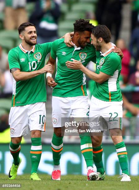 Cyrus Christie of the Republic of Ireland celebrates scoring his team's second goal with Robbie Brady and Harry Arter during the International...