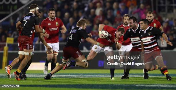 Stuart Hogg of the Lions is tackled during the match between the New Zealand Provincial Barbarians and the British & Irish Lions at Toll Stadium on...