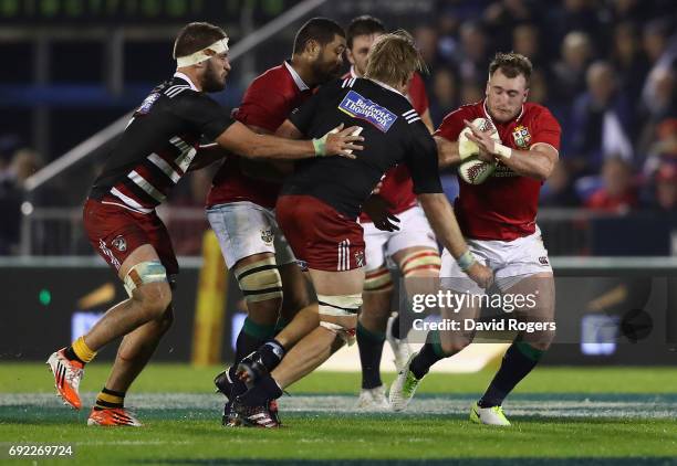 Stuart Hogg of the Lions is tackled during the match between the New Zealand Provincial Barbarians and the British & Irish Lions at Toll Stadium on...