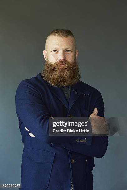 bearded man vintage jacket studio portrait - testosterone stockfoto's en -beelden