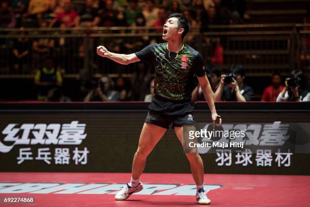 Xin Xu of China celebrates during Men's Singles quarter final against Tomokazu Harimoto of Japan at Table Tennis World Championship at at Messe...
