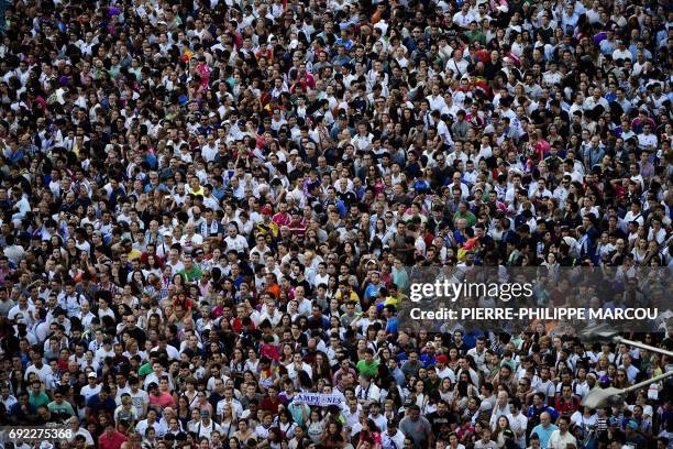 Real Madrid football team fans celebrate the team's win on Plaza Cibeles in Madrid on June 4, 2017 after the UEFA Champions League football match...
