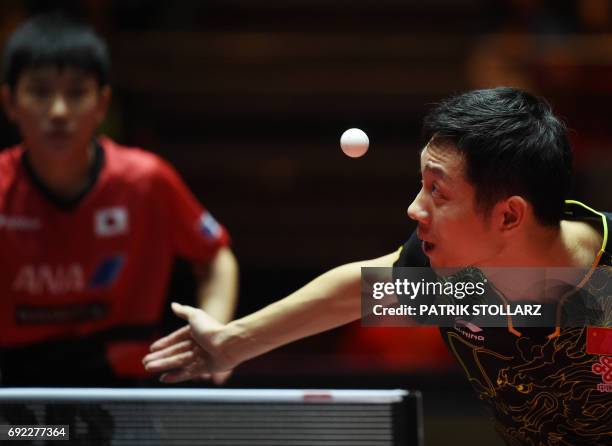 Chinese Xu Xin plays against Japanese Tomokazu Harimoto during the WTTC World Table Tennis Championships men's single in Duesseldorf, western Germany...