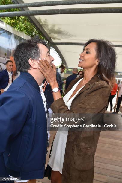 Hosts Stephane Plaza and Karine Le Marchand attend the 2017 French Tennis Open - Day Height at Roland Garros on June 4, 2017 in Paris, France.