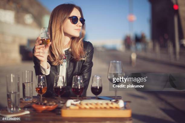 woman with wine testing glasses - alcohol drink sizes stock pictures, royalty-free photos & images