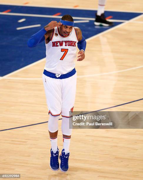 Carmelo Anthony of the New York Knicks celebrates scoring a 3 point shot in an NBA basketball game against the Sacramento Kings on December 4, 2016...