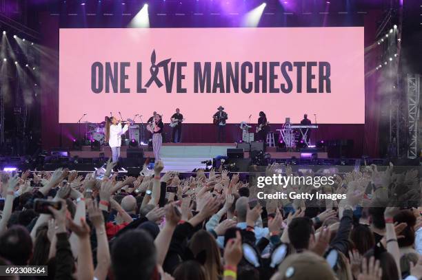 Free for editorial use. In this handout provided by 'One Love Manchester' benefit concert Ariana Grande and Miley Cyrus perform on stage on June 4,...