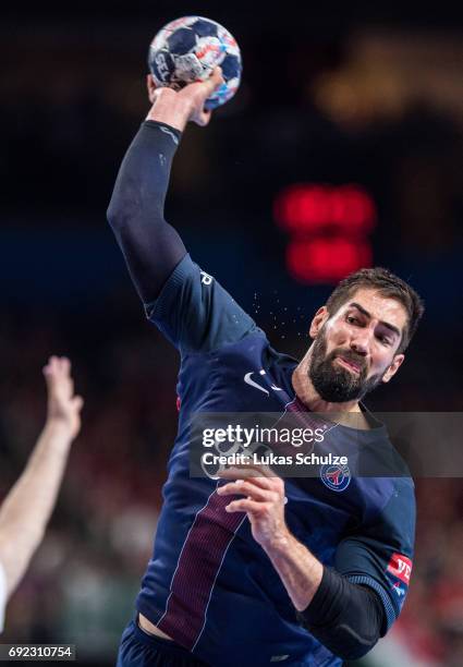 Nikola Karabatic of Paris throws the ball during the VELUX EHF FINAL4 Final match between Paris Saint-Germain Handball and HC Vardar at Lanxess Arena...