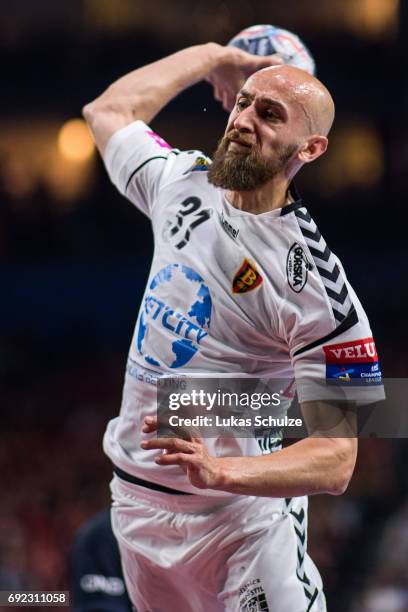 Timur Dibirov of Vardar throws the ball during the VELUX EHF FINAL4 Final match between Paris Saint-Germain Handball and HC Vardar at Lanxess Arena...