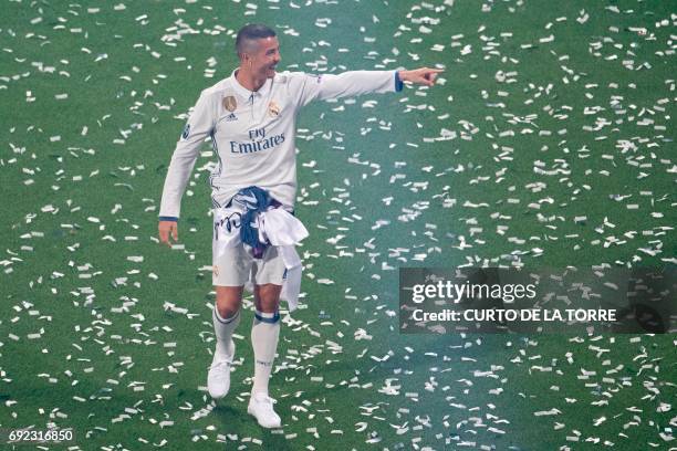 Real Madrid's Portuguese forward Cristiano Ronaldo points during a celebration event held at the Santiago Bernabeu stadium after the team won the the...