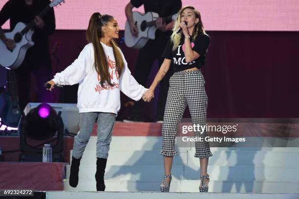 Free for editorial use. In this handout provided by 'One Love Manchester' benefit concert Ariana Grande and Miley Cyrus perform on stage on June 4,...