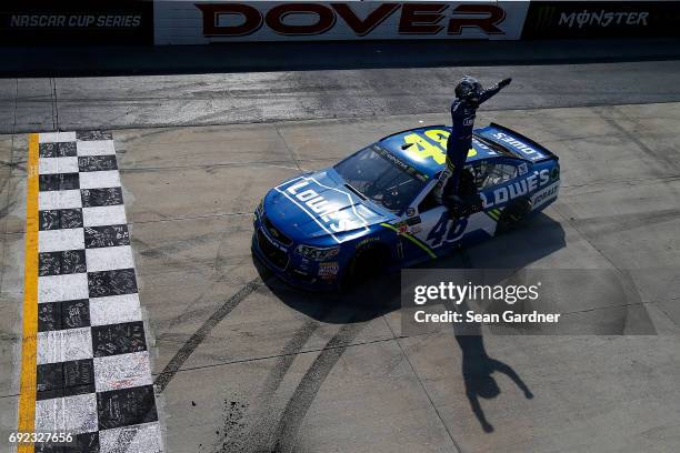 Jimmie Johnson, driver of the Lowe's Chevrolet, celebrates after winning the Monster Energy NASCAR Cup Series AAA 400 Drive for Autism at Dover...