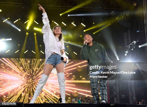 Miley Cyrus performs on stage with Pharrell Williams during the One Love Manchester Benefit Concert at Old Trafford Cricket Ground on June 4, 2017 in...