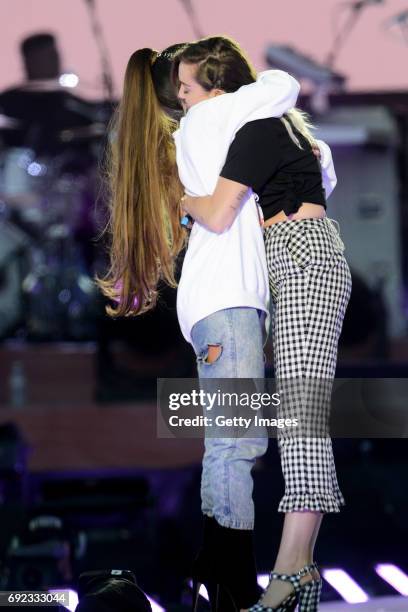 Free for editorial use. In this handout provided by 'One Love Manchester' benefit concert Ariana Grande and Miley Cyrus perform on stage on June 4,...