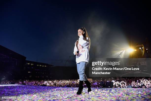 Ariana Grande wipes away a tear as she performs on stage during the One Love Manchester Benefit Concert at Old Trafford Cricket Ground on June 4,...