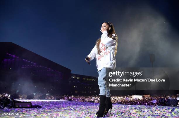 Ariana Grande wipes away a tear as she performs on stage during the One Love Manchester Benefit Concert at Old Trafford Cricket Ground on June 4,...