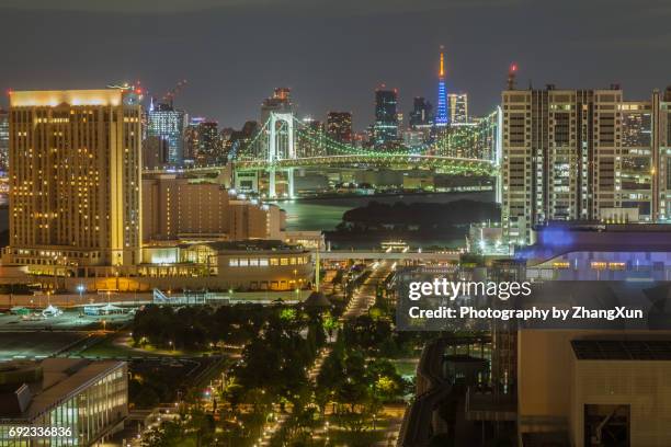 tokyo city skyline of odaiba area, tokyo bay waterfront at night, japan. - tokyo bay stock pictures, royalty-free photos & images