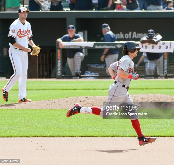 Boston Red Sox left fielder Andrew Benintendi rounds the bases following his second home run of the game in the seventh inning off of Baltimore...