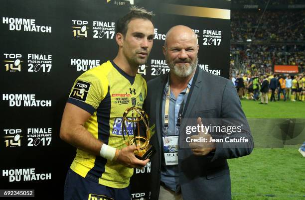 Morgan Parra of ASM Clermont receives from Chef Philippe Etchebest the trophy of 'best player of the match' following the Top 14 final match between...