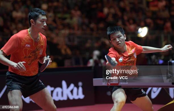 Xu Xin of China and Fan Zhendong of China compete during Men's Doubles final match against Masataka Morizono of Japan and Yuya Oshima of Japan on day...