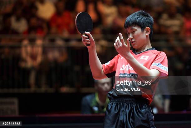 Tomokazu Harimoto of Japan competes during Men's Singles quarterfinal match against Xu Xin of China on day 7 of World Table Tennis Championships at...