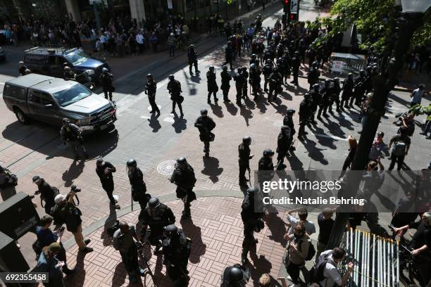 Police block off a street, and cordon 'Antifa' protesters following an assault on a police officer at a rally on June 4, 2017 in Portland, Oregon. A...