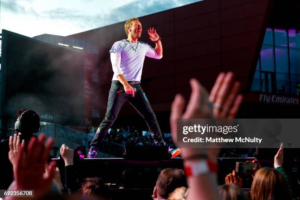 Chris Martin of Coldplay performs during the One Love Manchester concert at Old Trafford Cricket Ground Cricket Club on June 4, 2017 in Manchester,...