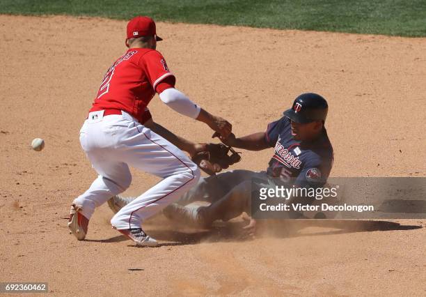 Eduardo Escobar of the Minnesota Twins collides with Andrelton Simmons of the Los Angeles Angels of Anaheim at second base on Escobar's steal attempt...