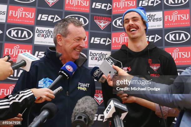 Bombers legend Neale Daniher speaks to media with nephew Joe Daniher of the Bombers during a cheque presentation to fight MND at the Essendon...