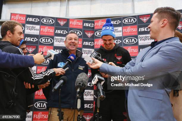 Bombers legend Neale Daniher speaks to media with nephew Joe Daniher of the Bombers during a cheque presentation to fight MND at the Essendon...