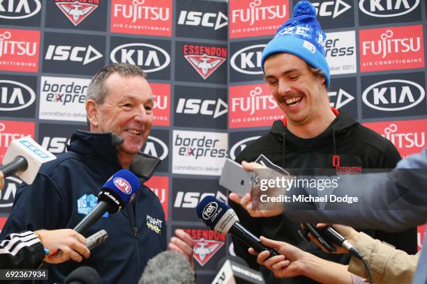 Bombers legend Neale Daniher speaks to media with nephew Joe Daniher of the Bombers during a cheque presentation to fight MND at the Essendon...