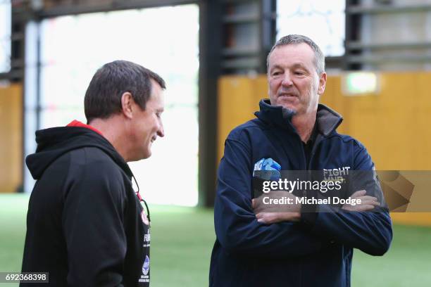 Bombers legend Neale Daniher speaks to Bombers head coach John Worsfold after a cheque presentation to fight MND at the Essendon Football Club on...