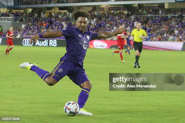 Giles Barnes of Orlando City SC kicks the ball during a MLS soccer match between the Chicago Fire and the Orlando City SC at Orlando City Stadium on...