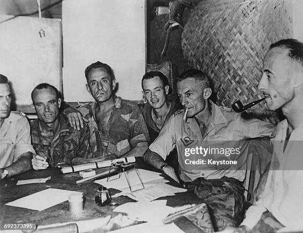 Conference at the French military headquarters in Dien Bien Phu, Vietnam, during the First Indochina War, March 1954. From left to right, André...